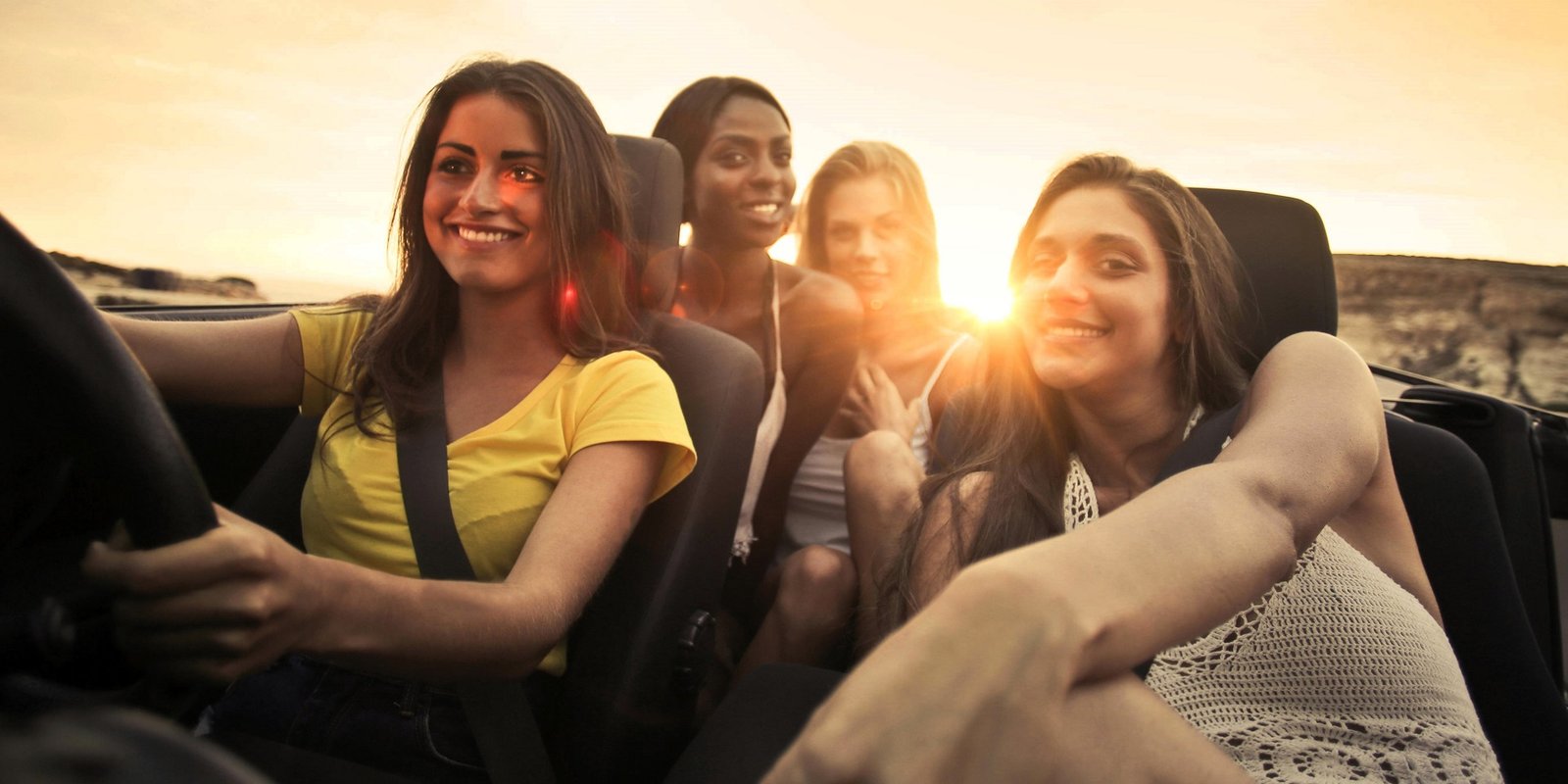 group of girls drive a rental car in palm springs