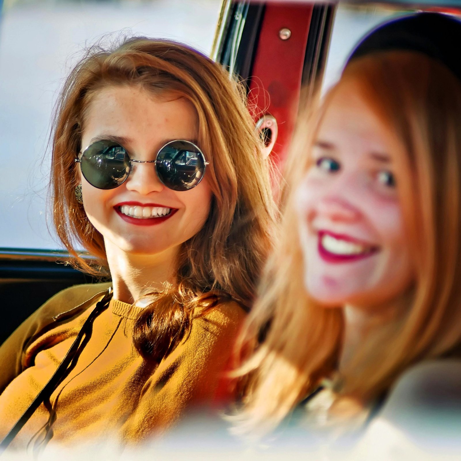 two girls drive a rental car in palm springs